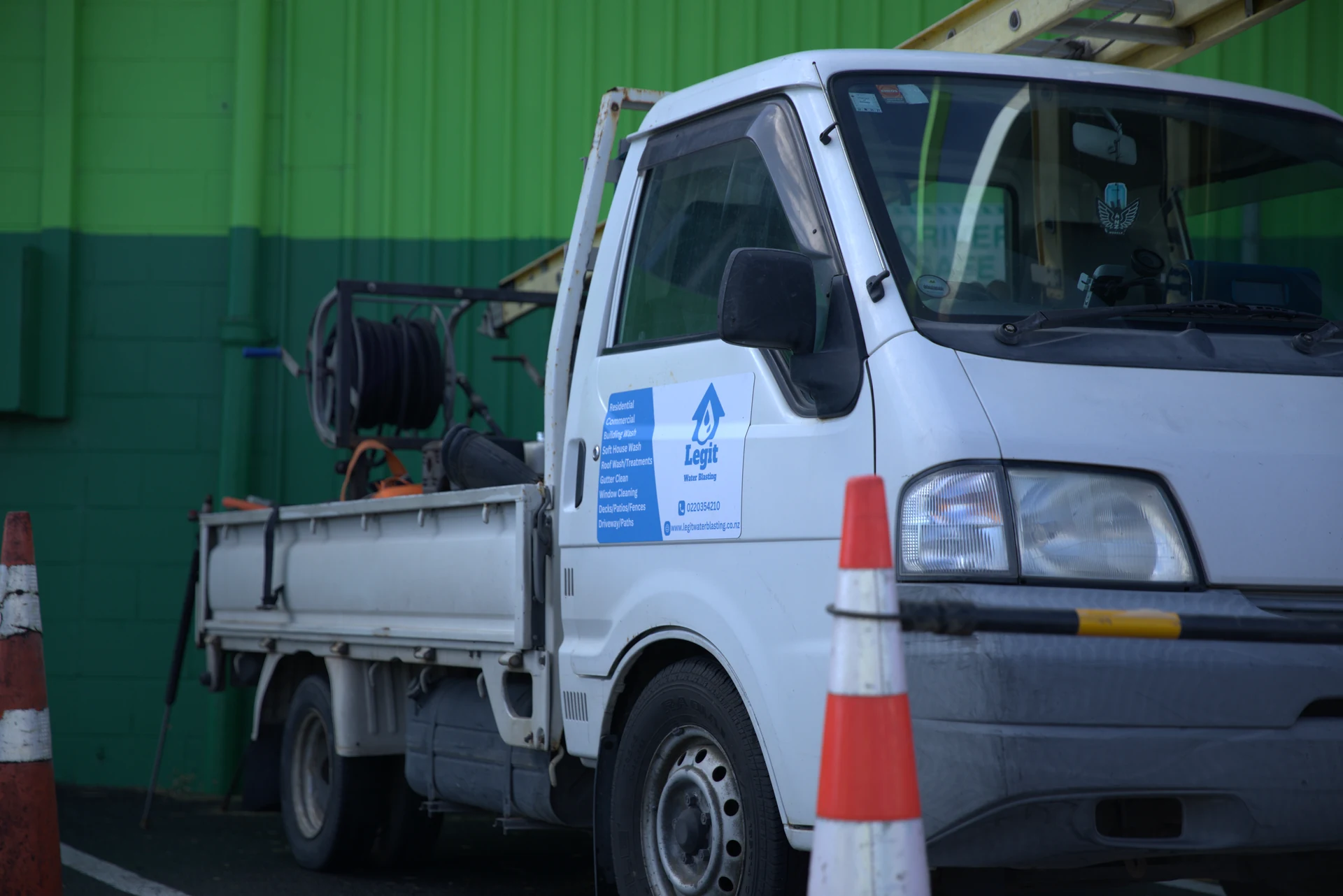 Certified safety technician washing commercial roof